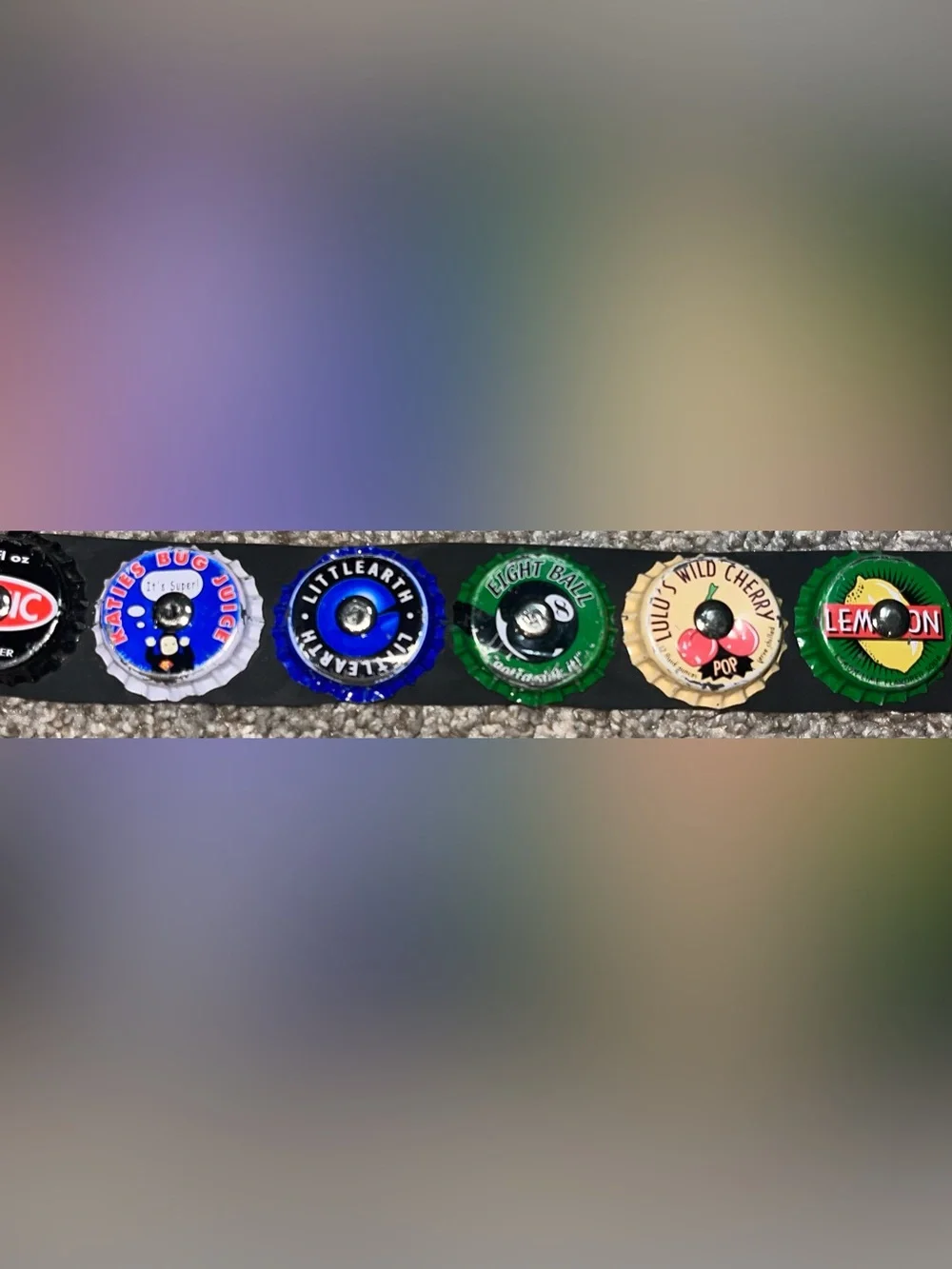 Little Earth seatbelt belt bottle caps